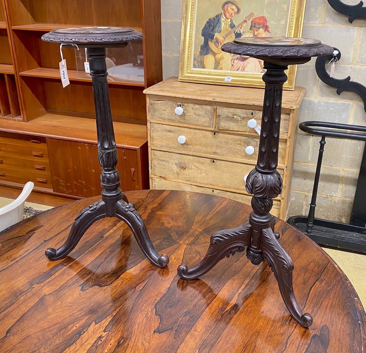 A near pair of Victorian style tripod tables with circular specimen marble tops, larger diameter 30cm, height 74cm